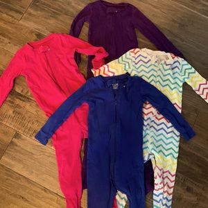 Set of 4. Primary. 18-24 footie pajamas. All zip. All good condition.